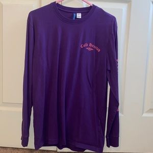 Men’s long sleeve size medium purple with peach writing.